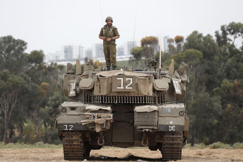 Israeli military tries to strengthen borders with Gaza as battle enters third day  / ATEF SAFADI